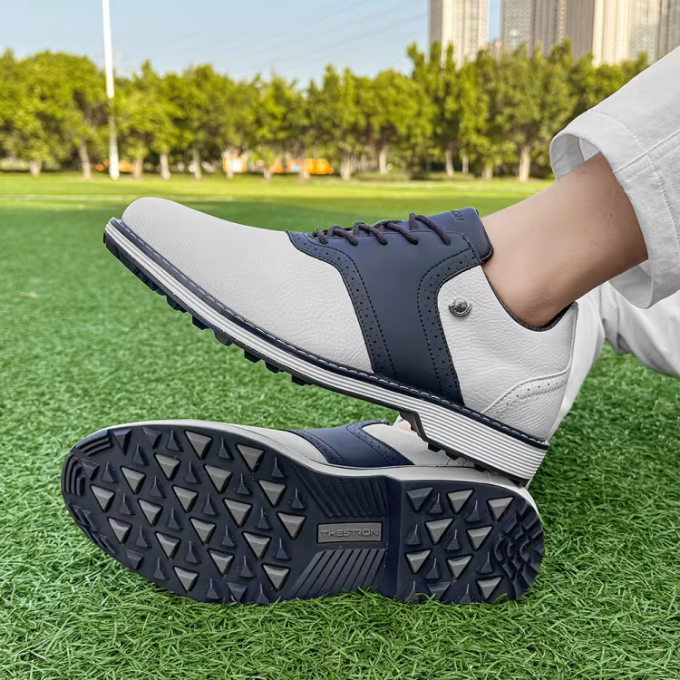 Athletic men's spiked golf footwear, classic leather finish, providing maximum comfort and grip.