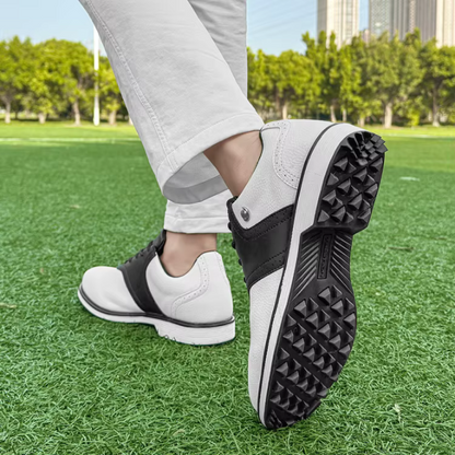 Men's athletic golf shoes, spiked, featuring a waterproof leather upper for all-weather play.