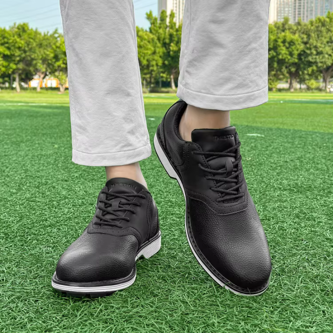 Men's leather golf shoes, classic spiked, offering superior all-weather grip on the fairway.