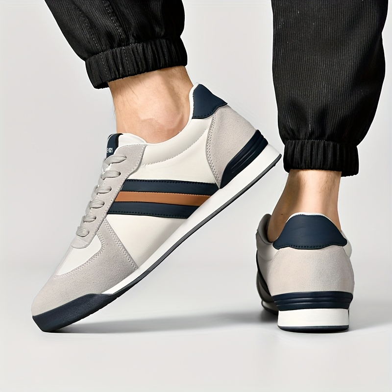 Comfortable men's walking shoes, classic striped design for casual outings.