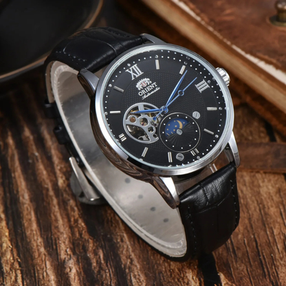 Side view of men's classic Sun & Moon automatic watch, showcasing case design and leather band texture.