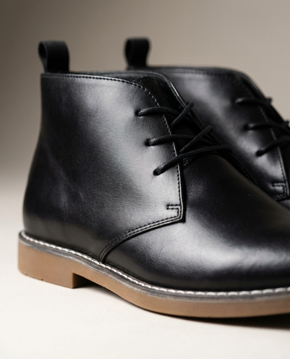 Classic men's desert boots in rich brown leather, offering comfort and style for work or casual outfits.