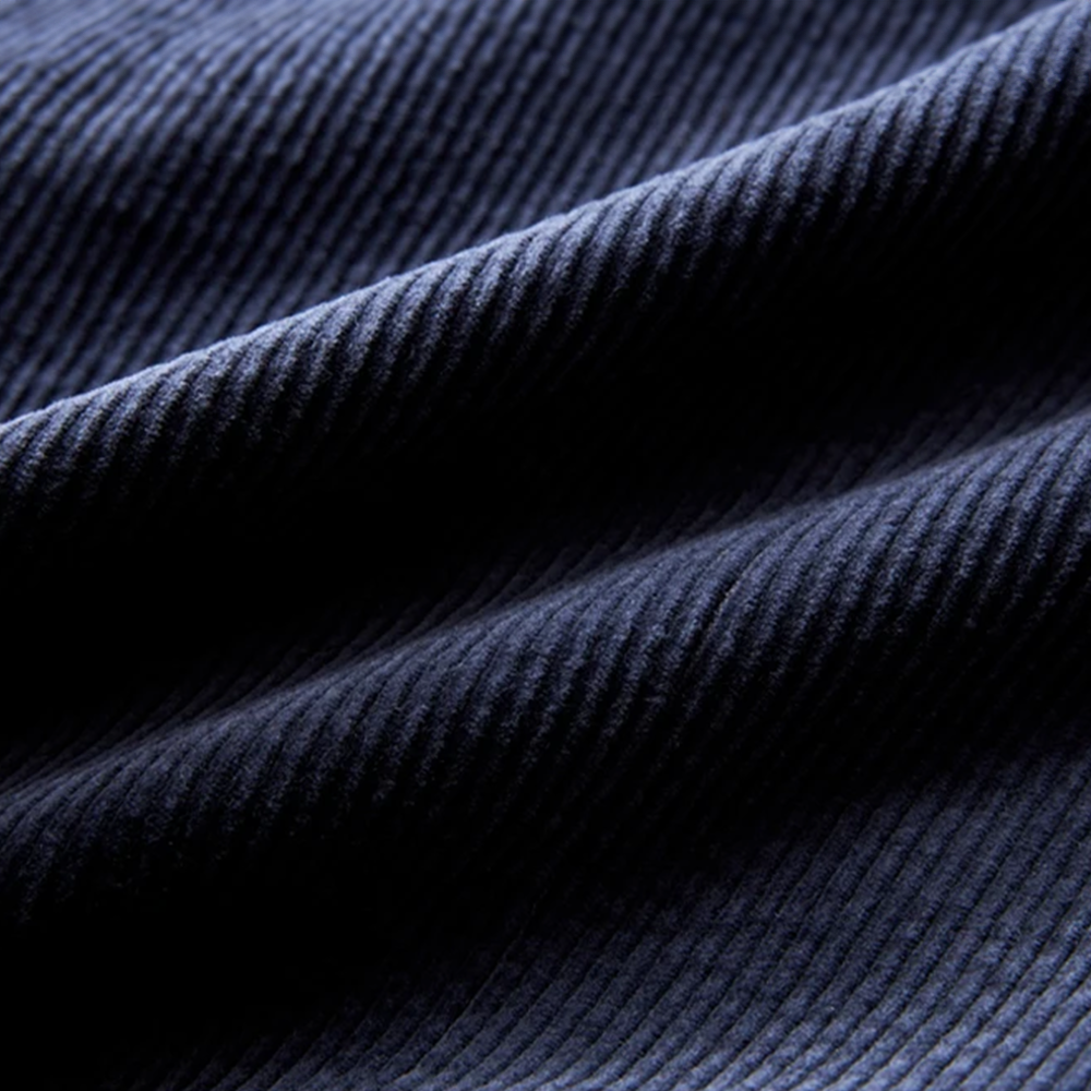 Modern men's textured blazer, perfect for creating a versatile layered look for any smart casual or business ensemble.