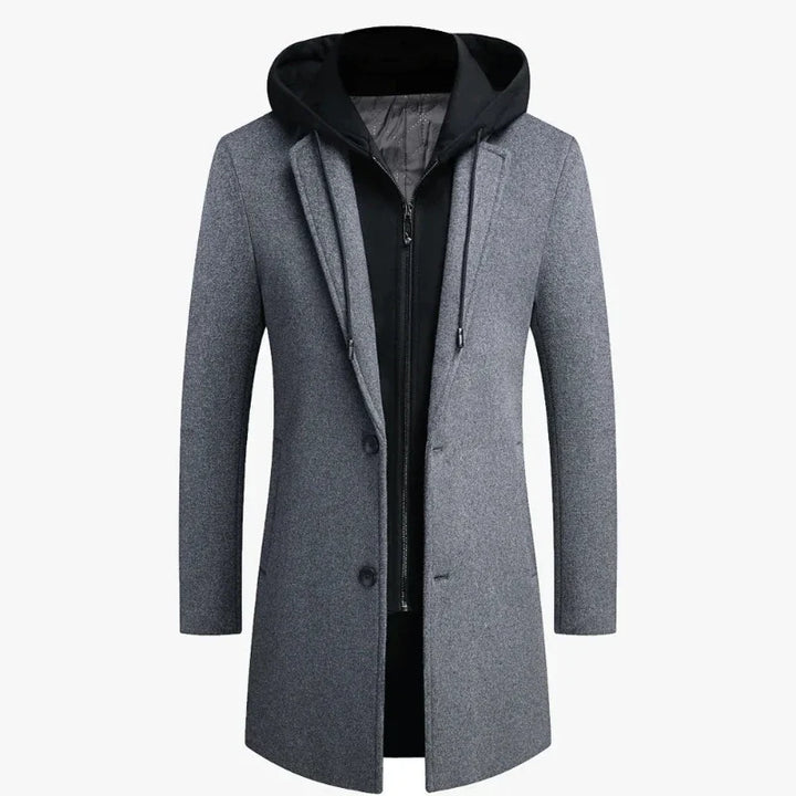 Full-length shot of a men's classic trench coat, featuring a detachable hood. Versatile long overcoat.