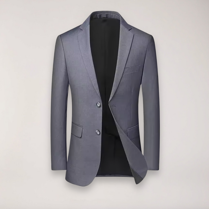 Dark grey men's two-piece suit for party wear, featuring a modern blazer & well-fitted trousers.