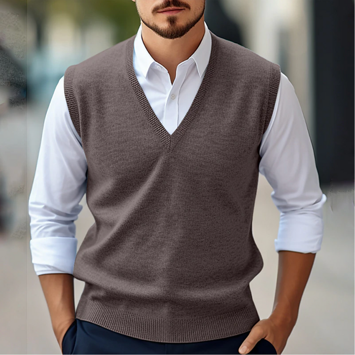 Close-up of a men's V-neck sweater vest, showcasing the knit texture. A timeless piece for a polished style.