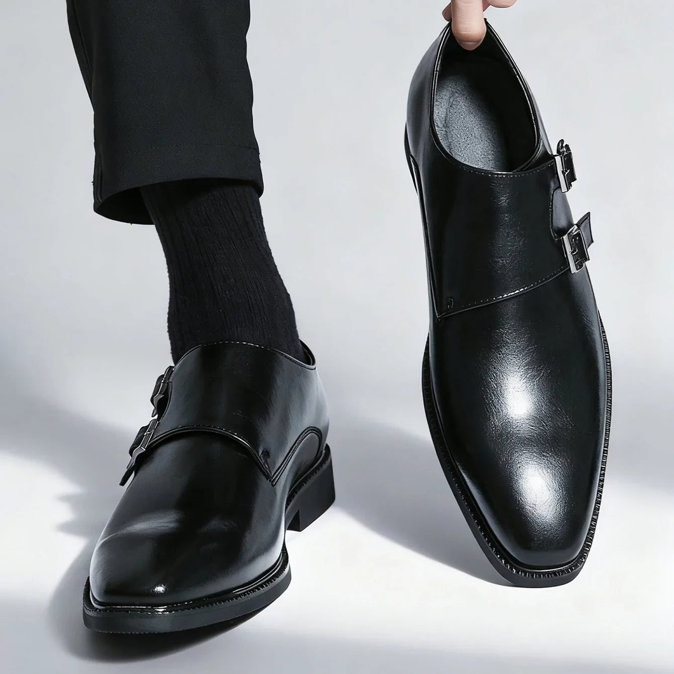 Detail shot of the quality leather texture on Valmont double buckle men's loafers. Comfortable footwear.