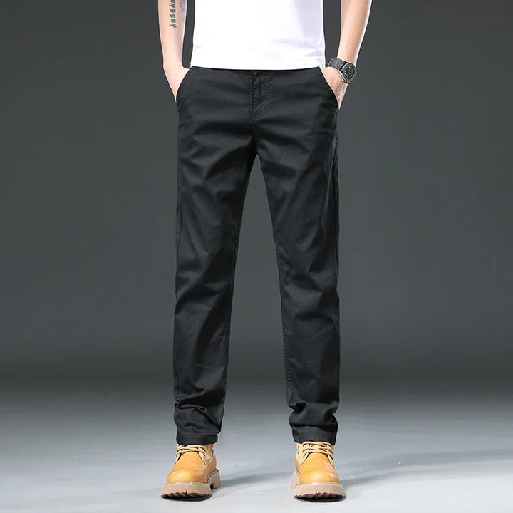 Khaki men's versatile casual pants, ideal for travel and everyday comfort, offering a flexible fit.