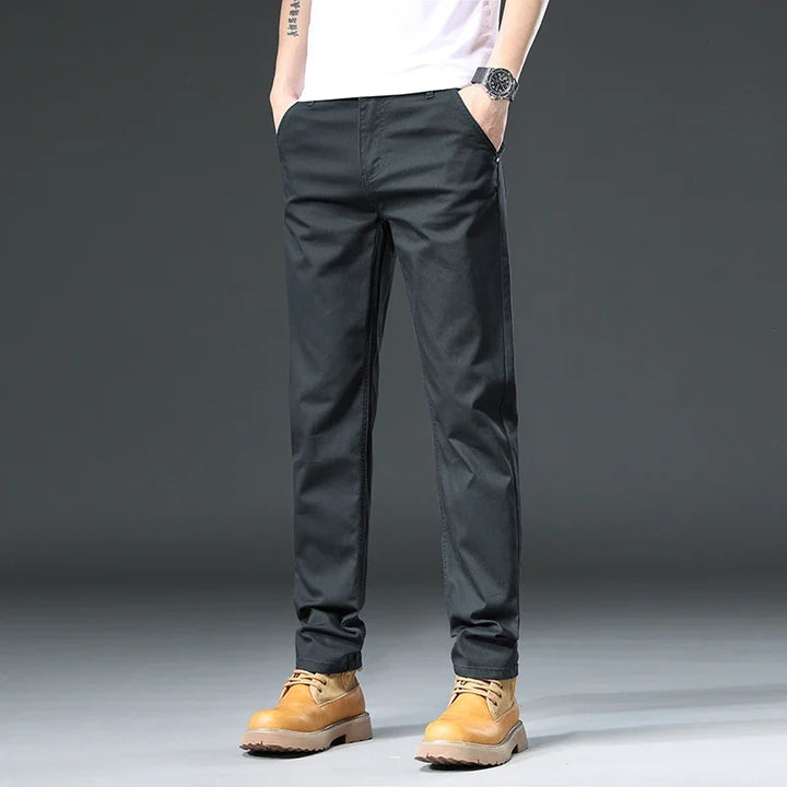 Close-up of comfortable men's versatile pants fabric, highlighting flexible fit for casual and office attire.