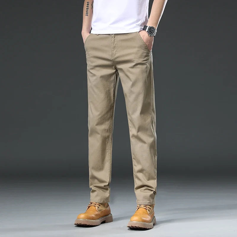 Gray men's everyday versatile pants, comfortable for travel and casual wear, with a flexible fit and classic style.