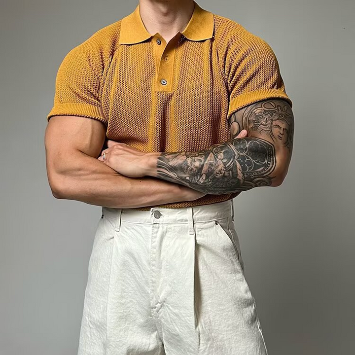 Classic men's polo shirt, distinct waffle weave fabric, structured collar, short sleeve, button.