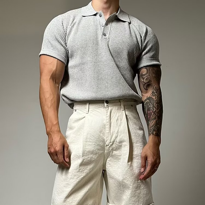 Classic style men's waffle polo shirt with a sophisticated structured collar and short sleeves.