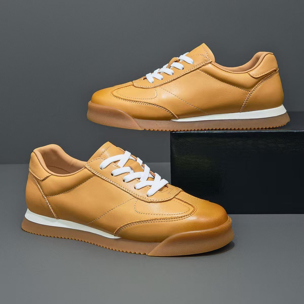 Classic men's genuine leather sneakers in a neutral color, perfect for a versatile everyday lifestyle.