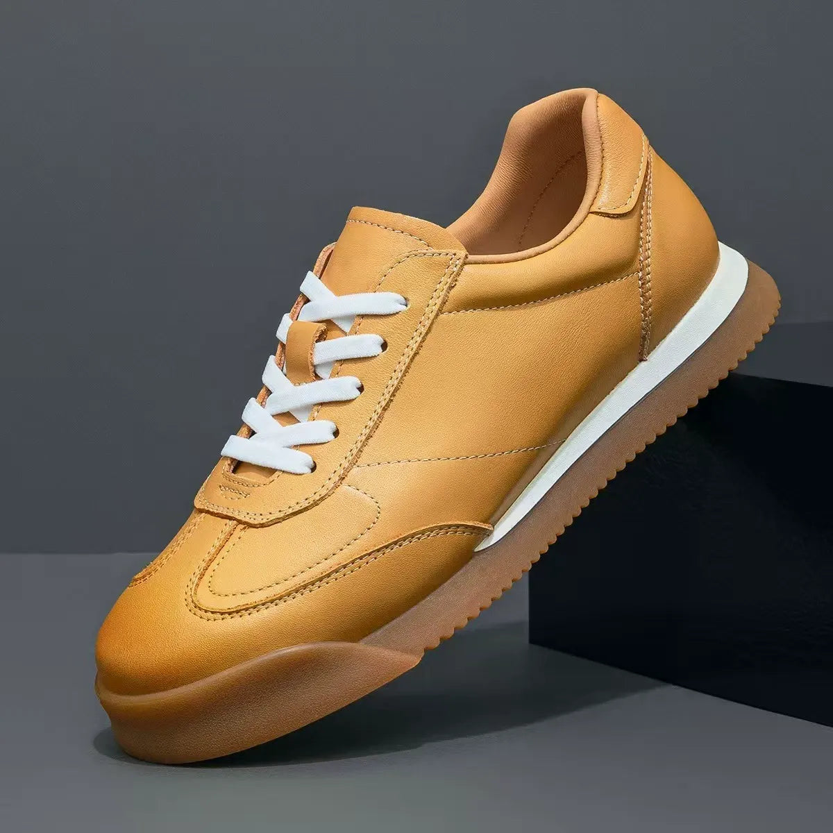 White men's classic leather lifestyle sneaker. Comfortable & versatile genuine leather casual shoe.