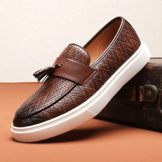 Men's classic woven loafers with elegant tassel accent. Stylish slip-on footwear perfect for casual or dressy occasions.