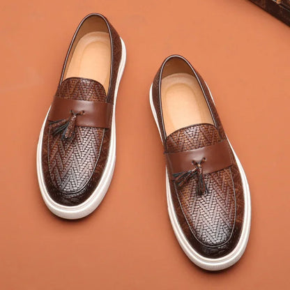 Brown men's woven tassel loafers. Comfortable slip-on dress shoes or casual footwear for a timeless, stylish look.