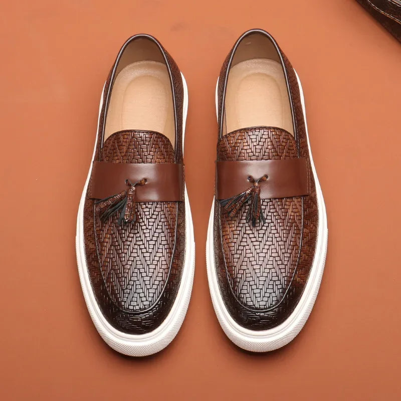 Stylish men's woven slip-on loafers with tassel detail. Comfortable and classic men's footwear for easy everyday wear.