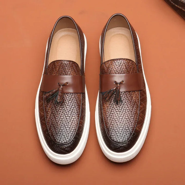 Stylish men's woven slip-on loafers with tassel detail. Comfortable and classic men's footwear for easy everyday wear.