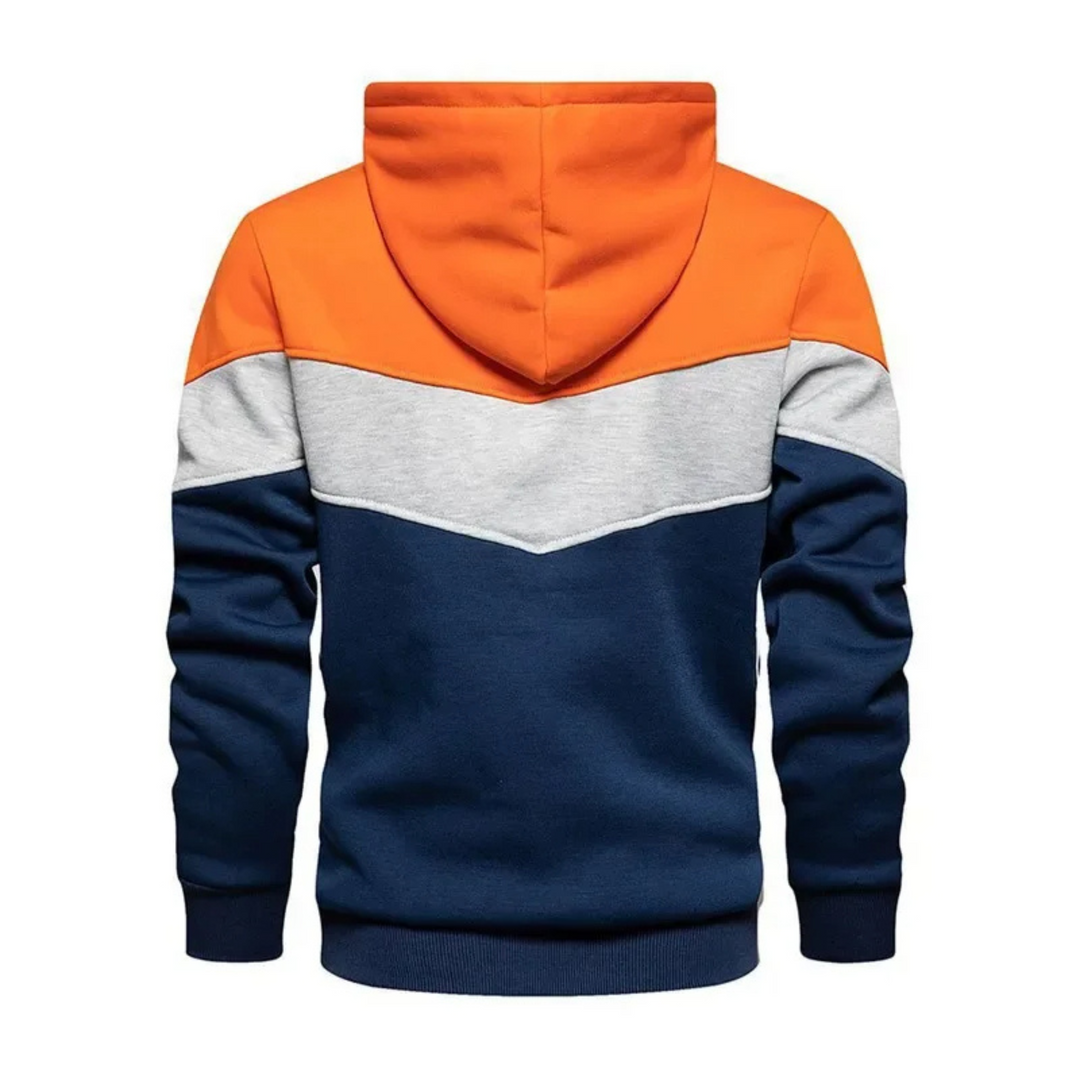 Man in stylish colorblock athletic hoodie, showcasing dynamic urban casual wear.