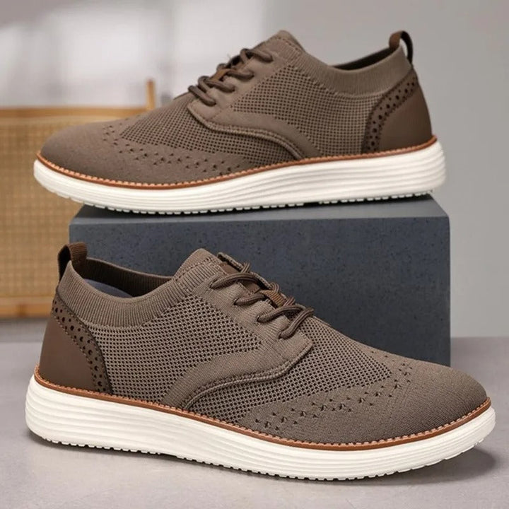 Elegant men's wingtip dress sneakers, designed for all-day comfort and sophisticated fashion.