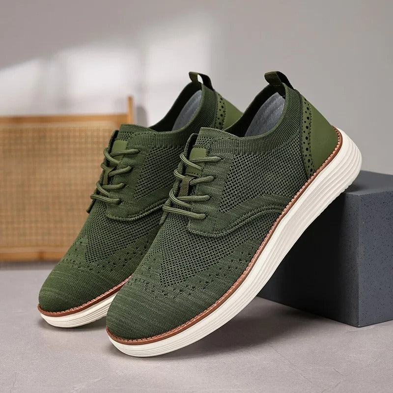 Top-down view of men's comfort dress sneakers, showcasing wingtip pattern and lace-up closure.
