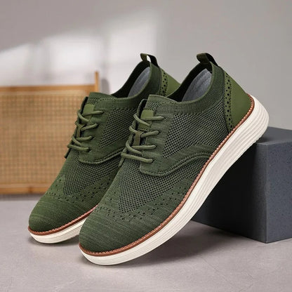 Top-down view of men's comfort dress sneakers, showcasing wingtip pattern and lace-up closure.