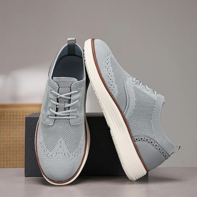 Lightweight men's comfort shoes, wingtip dress sneakers ideal for casual formal outfits.