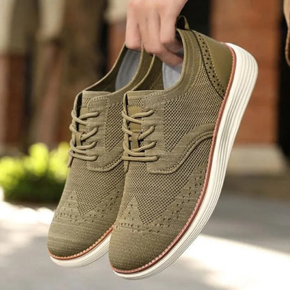 Stylish men's wingtip dress sneakers offering lightweight, breathable all-day comfort.