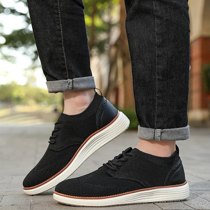 Side profile of men's lightweight dress sneakers, wingtip style for ultimate comfort and fashion.