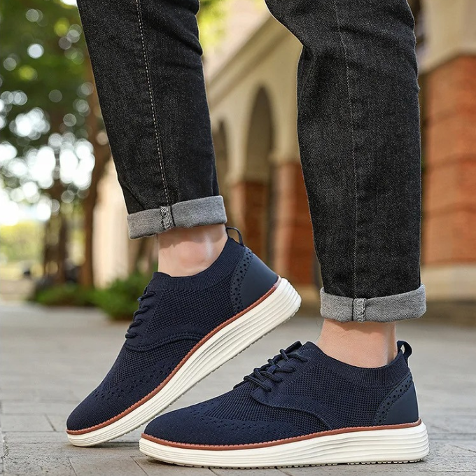 Versatile men's wingtip dress sneakers, combining casual comfort with formal style.