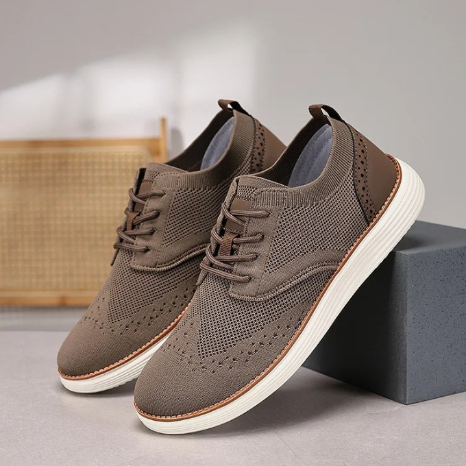 Breathable men's comfort shoes, wingtip dress sneakers for lightweight all-day wear.