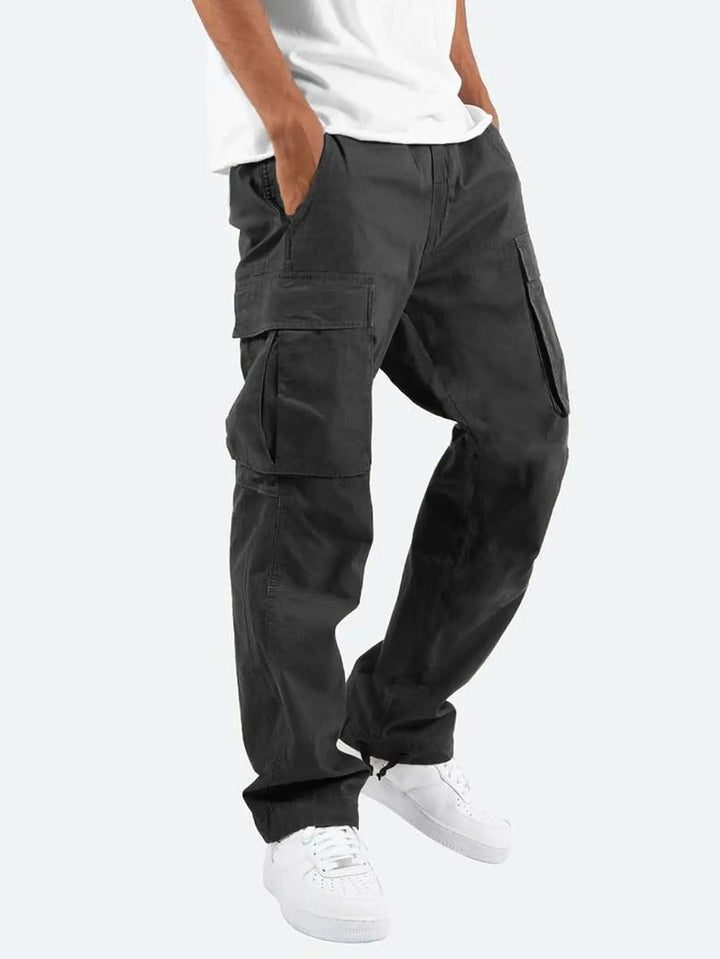 Man wearing stylish gray drawstring cargo pants, suitable for casual outings & comfortable everyday fashion.