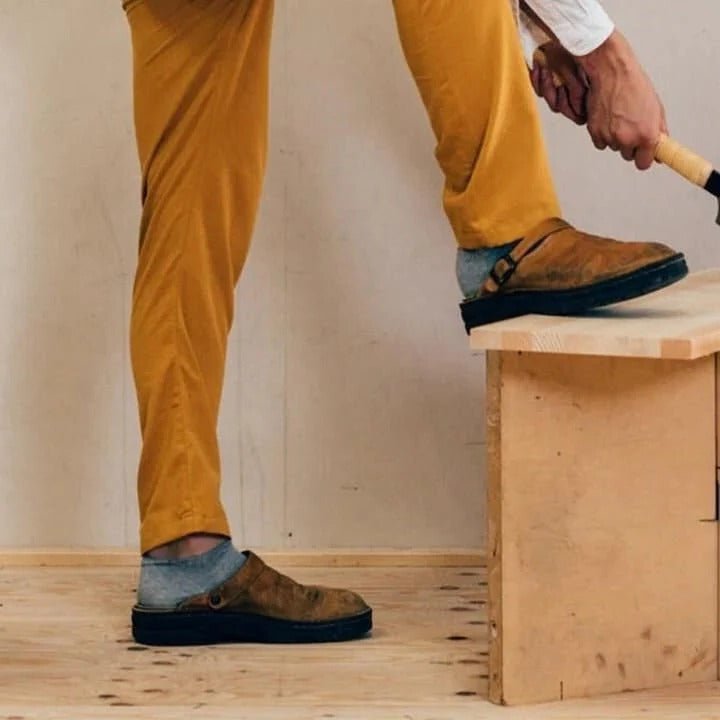 Comfortable men's indoor-outdoor mules with a practical slip-on design and heel strap.