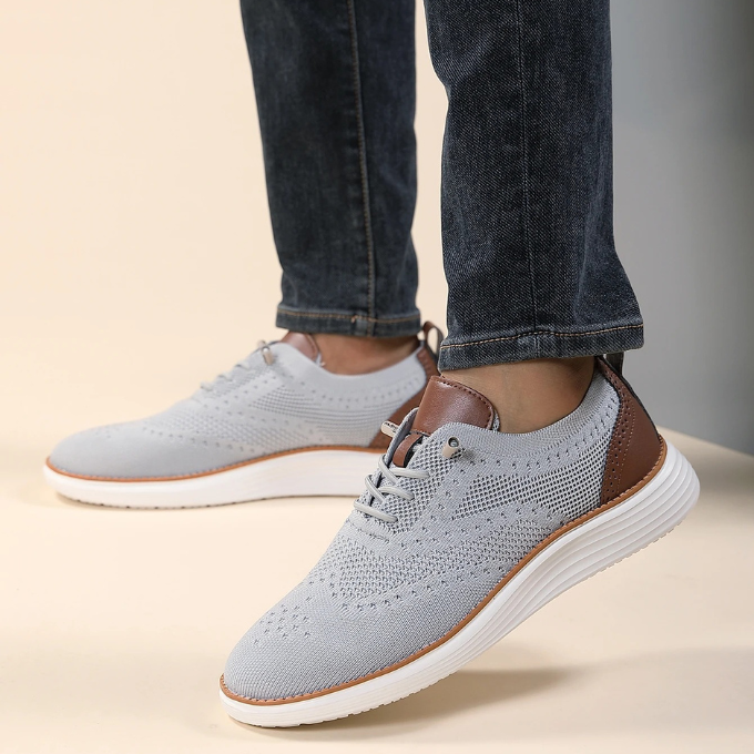 Orthopedic men's dress sneakers with classic brogue detailing & anti-odor tech.