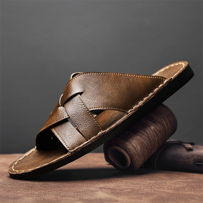 Men's comfortable brown cross-strap sandals with flat sole, perfect for casual summer walking.
