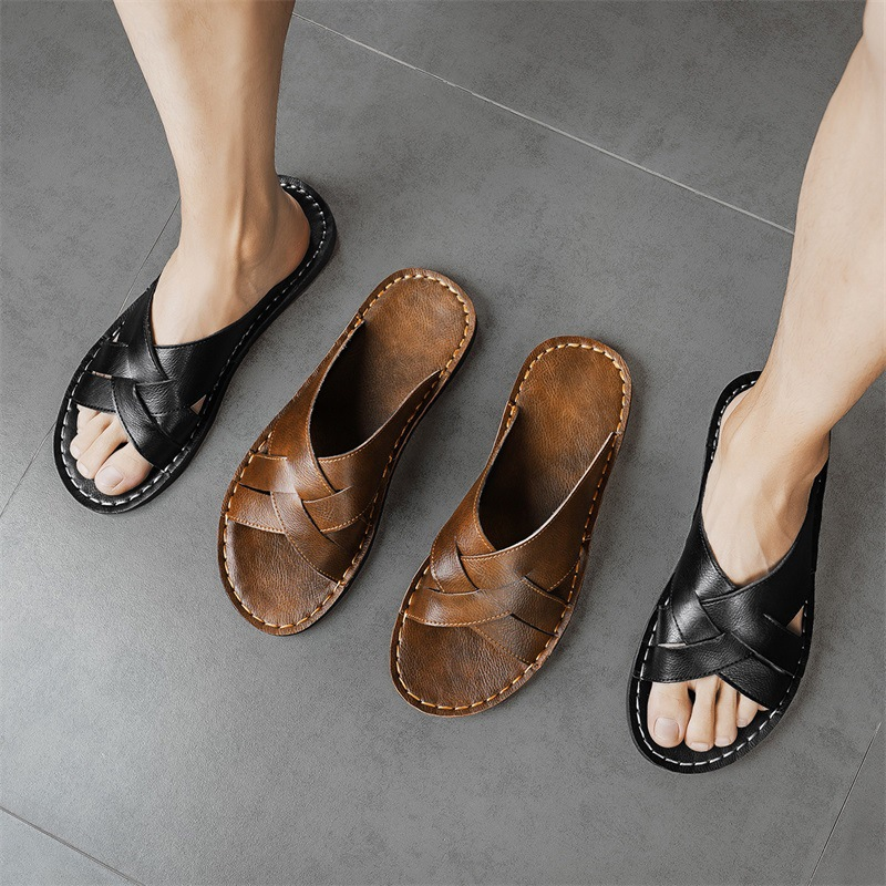 Easy slip-on men's black cross-strap flat sandals, comfortable open-toe summer footwear for casual days.
