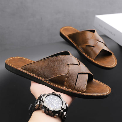 Men's walking sandals: comfortable brown cross-strap design with flat sole for summer adventures.