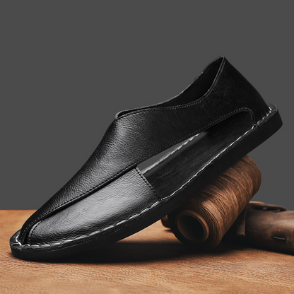 Detail of the comfortable flat sole on men's open-toe walking sandals.
