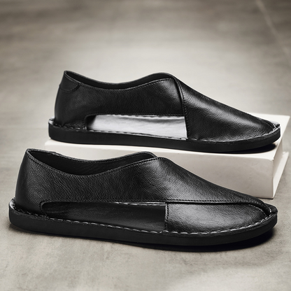 Men's open-toe sandals, featuring secure cross-strap and flat sole for comfort.