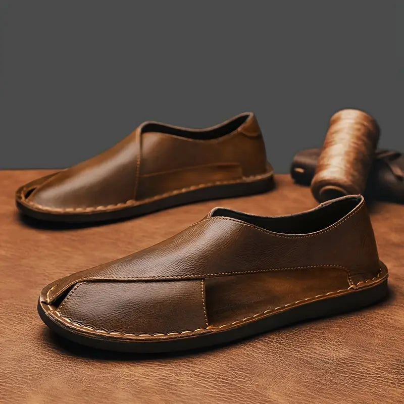 Stylish men's open-toe sandals with a practical crossover design & flat sole.