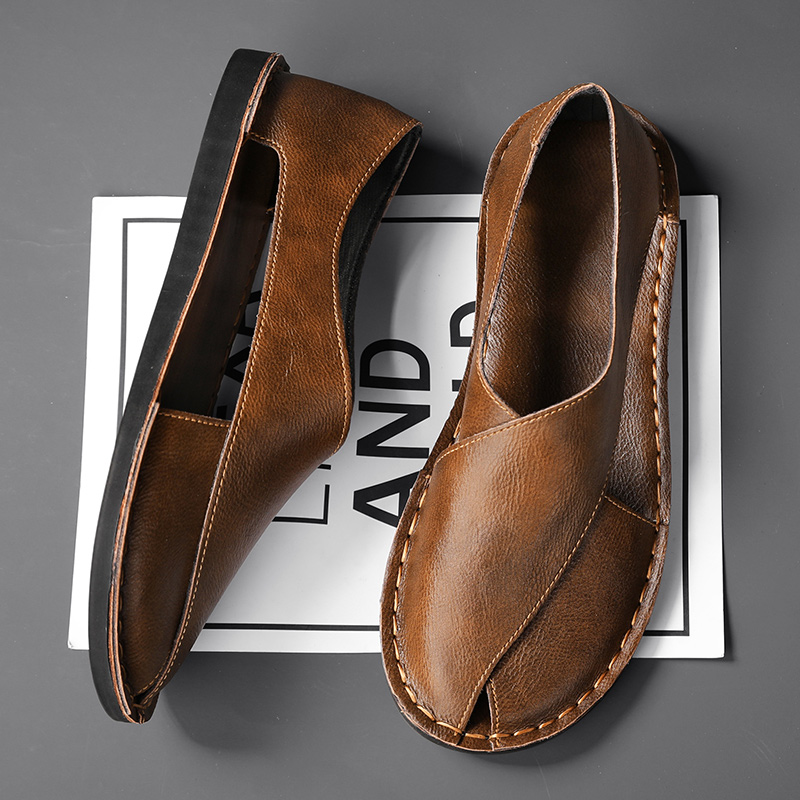 Top-down shot of comfortable men's summer sandals with stylish cross straps.