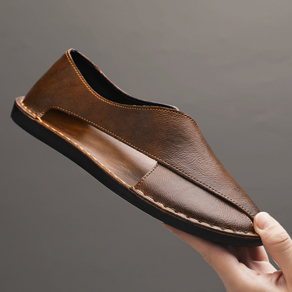 Men's walking sandals, showcasing supportive cross-strap system & flat sole.