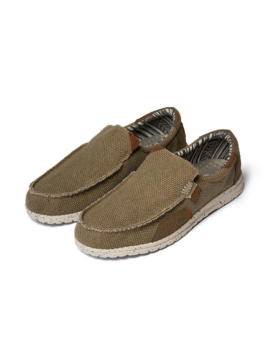 Men's comfortable khaki canvas slip-on shoes for casual everyday wear with a durable rubber sole.