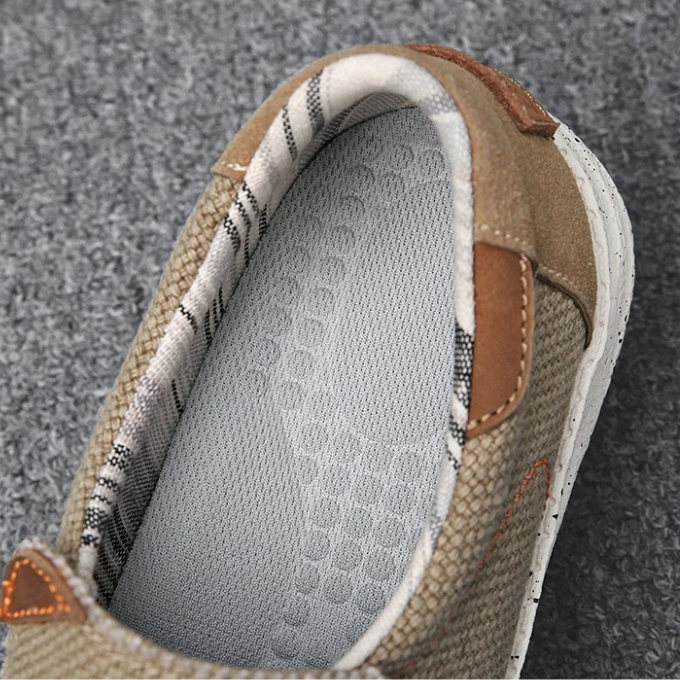 Stylish gray men's canvas slip-on shoes, designed for comfortable everyday use with an easy-wear design.