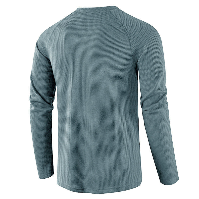 Close-up of knit fabric on men's comfortable henley shirt, showcasing quality.