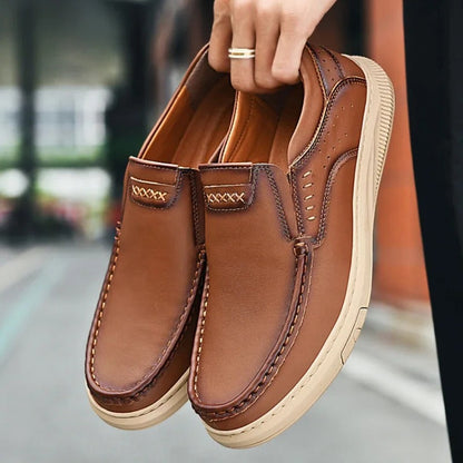 Front view of classic men's comfortable leather slip-on loafers for versatile styling.