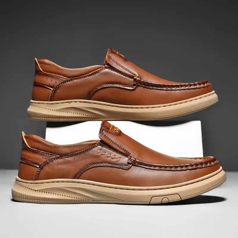 Close-up of comfortable men's leather slip-on loafers, showing cowhide texture and craftsmanship.