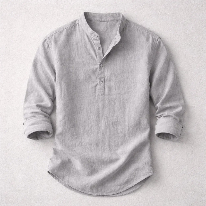 Closeup of a comfortable men's long sleeve henley shirt, showing button-up placket detail & fabric texture.