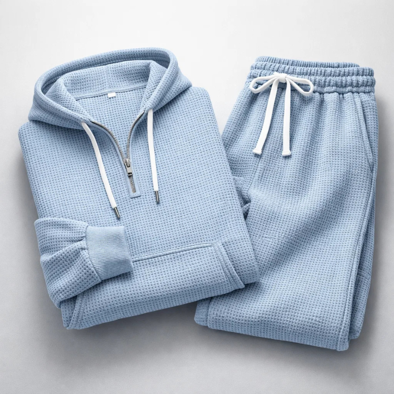Close-up of the soft, textured fabric on a men's casual lounge hoodie and matching joggers.