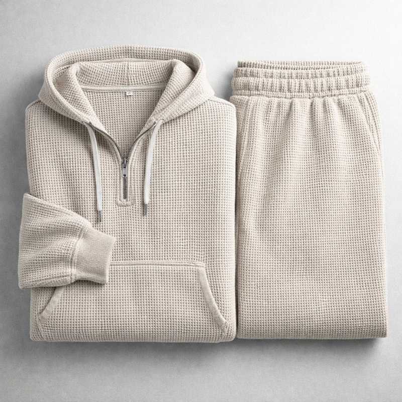 Stylish men's two-piece textured track suit, a comfortable hoodie & joggers for casual wear.